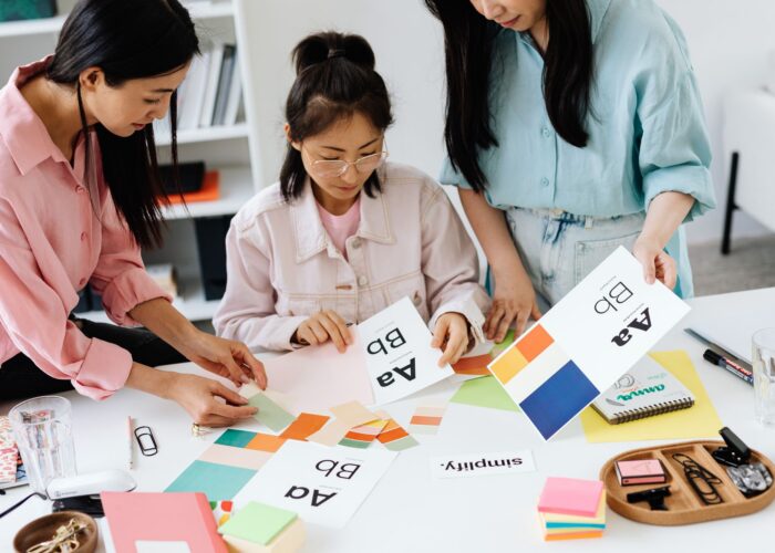 Branding team reviewing colour palettes and typography for a brand identity project