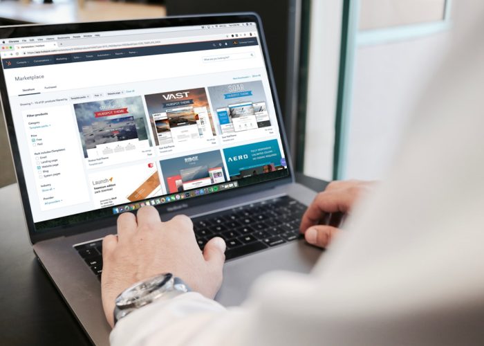 Professional using a laptop to manage lead generation campaigns