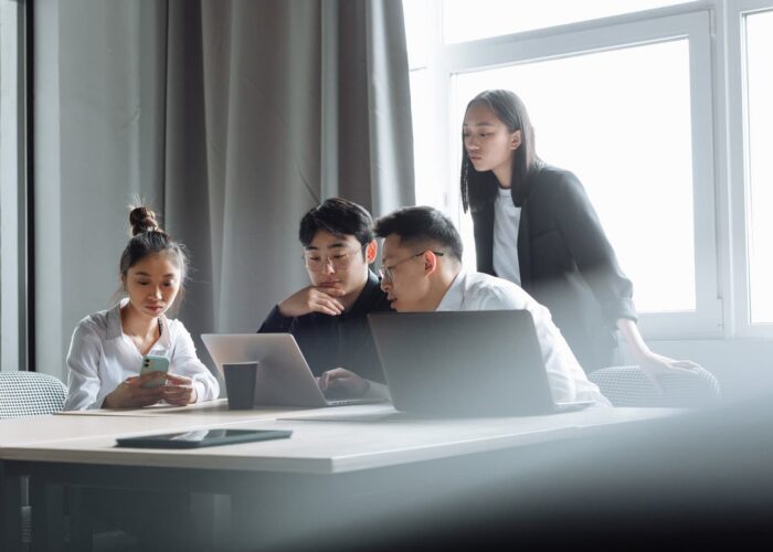 Team discussing social media marketing strategy in an office